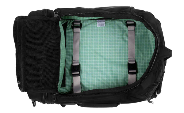 An open Techonaut 30 with a Black exterior and a Seafoam (blue-green) interior.